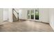 Bright living room features modern flooring and large windows for ample natural light at 120 Jo Anne Cir, Cary, NC 27513