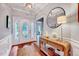 Welcoming foyer with hardwood floors, elegant lighting, and decorative accents at 1216 Miracle Dr, Wake Forest, NC 27587