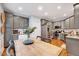 Stylish eat-in kitchen with stainless steel appliances and gray cabinets at 1216 Miracle Dr, Wake Forest, NC 27587