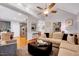 Spacious living room with open layout, modern decor, and seamless flow to dining at 1216 Miracle Dr, Wake Forest, NC 27587