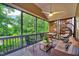 Relaxing screened porch with comfortable seating and peaceful outdoor views at 1216 Miracle Dr, Wake Forest, NC 27587