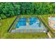 Well-maintained tennis courts available in the community, surrounded by lush greenery at 1216 Miracle Dr, Wake Forest, NC 27587