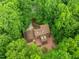Aerial view of home surrounded by lush green trees at 122 Blackcherry Ln, Chapel Hill, NC 27514