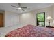 Bedroom with ceiling fan, large closet, and window view at 122 Blackcherry Ln, Chapel Hill, NC 27514