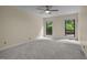 Bedroom with windows and neutral color palette at 122 Blackcherry Ln, Chapel Hill, NC 27514