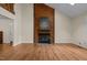 Spacious living room featuring a fireplace, hardwood floors, and natural light at 122 Blackcherry Ln, Chapel Hill, NC 27514