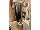 Functional bathroom featuring a shower, toilet, and vanity with storage at 1310 Ray Ave, Sanford, NC 27330