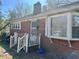 Charming single-story brick home featuring a cozy front porch and a bay window at 1310 Ray Ave, Sanford, NC 27330