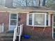 Charming single-story brick home featuring a cozy front porch and a bay window at 1310 Ray Ave, Sanford, NC 27330