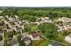A beautiful aerial view shows a residential neighborhood with tree-lined streets and manicured lawns at 1310 Silver Dr, Mebane, NC 27302