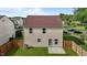 View of the backyard featuring a well-maintained lawn, privacy fence, and the home's exterior at 1310 Silver Dr, Mebane, NC 27302