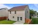 Backyard view of a home with vinyl siding, fenced yard, and a small patio at 1310 Silver Dr, Mebane, NC 27302