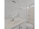 Well-lit bathroom featuring a shower-tub combo and a vanity with ample counter space at 1310 Silver Dr, Mebane, NC 27302
