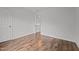 Inviting bedroom featuring wood-look floors, a door, and bright natural light at 1310 Silver Dr, Mebane, NC 27302