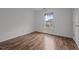 Comfortable bedroom featuring wood-look floors and a window providing natural light at 1310 Silver Dr, Mebane, NC 27302