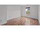 Neutral bedroom with laminate flooring and a large window at 1310 Silver Dr, Mebane, NC 27302