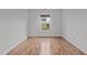 Neutral bedroom with laminate flooring and a large window at 1310 Silver Dr, Mebane, NC 27302