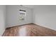 Bright bedroom featuring wood-look flooring and a window providing natural light at 1310 Silver Dr, Mebane, NC 27302