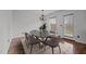 Inviting dining room featuring a modern table, stylish chairs, hardwood floors, and natural light at 1310 Silver Dr, Mebane, NC 27302