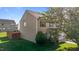 Charming two-story home with vinyl siding, fenced yard, and lush landscaping at 1310 Silver Dr, Mebane, NC 27302
