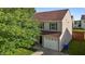Home exterior featuring a two-car garage, manicured lawn, and beautiful landscaping at 1310 Silver Dr, Mebane, NC 27302