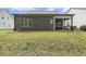 Home exterior with screened in porch and green grass at 1374 Patriot Points Way, Fuquay Varina, NC 27526