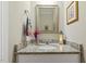 Charming powder room featuring granite countertop and decorative accents at 1374 Patriot Points Way, Fuquay Varina, NC 27526