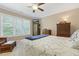 Comfortable bedroom features a large window and traditional wooden furniture at 1374 Patriot Points Way, Fuquay Varina, NC 27526