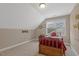 Inviting bedroom with sloped ceiling and ample natural light at 1374 Patriot Points Way, Fuquay Varina, NC 27526