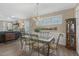 Dining room with decorative table, chandelier, natural light, next to the living room at 1374 Patriot Points Way, Fuquay Varina, NC 27526