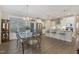 Bright kitchen and dining area with stainless steel appliances, island seating, and modern lighting at 1374 Patriot Points Way, Fuquay Varina, NC 27526