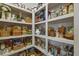 Spacious walk-in pantry with ample shelving for organized storage and assorted goods at 1374 Patriot Points Way, Fuquay Varina, NC 27526
