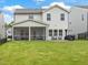 Large backyard with a screened-in porch, patio furniture, and a grill at 146 Bent Willow Dr, Clayton, NC 27527