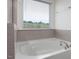 Oversized soaking tub with a view at 146 Bent Willow Dr, Clayton, NC 27527