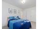 Bedroom features a queen bed with patterned bedding and wall decor at 146 Bent Willow Dr, Clayton, NC 27527