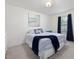Cozy bedroom features a full bed with blue bedding and dark curtains at 146 Bent Willow Dr, Clayton, NC 27527