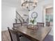 Elegant dining area with a large table, stylish decor, and hardwood floors at 146 Bent Willow Dr, Clayton, NC 27527