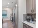 Kitchen features stainless steel appliances, stylish tile backsplash, and hardwood floors at 146 Bent Willow Dr, Clayton, NC 27527