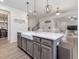 Kitchen island with a sink and dining area, open to the living space at 146 Bent Willow Dr, Clayton, NC 27527