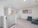 Upstairs loft area showcasing neutral carpet, white walls, and natural light at 146 Bent Willow Dr, Clayton, NC 27527