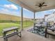 Screened porch with seating and view of fenced backyard at 146 Bent Willow Dr, Clayton, NC 27527