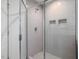Walk-in shower with sleek glass doors and subway tile at 146 Bent Willow Dr, Clayton, NC 27527