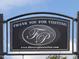 Community sign for Flowers Plantation with website address at 146 Bent Willow Dr, Clayton, NC 27527