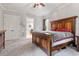 Spacious bedroom with carpet, ceiling fan, wooden furniture, and large windows at 1508 Banks Brooke Dr, Raleigh, NC 27603