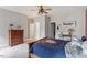Bright bedroom with a ceiling fan, dresser, carpet, and a comfortable bed with Star Wars themed decor at 1508 Banks Brooke Dr, Raleigh, NC 27603