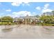 Community clubhouse featuring stone accents, a gated entrance, and accessible parking at 1508 Banks Brooke Dr, Raleigh, NC 27603
