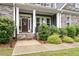 Inviting front entrance with stone steps and a decorated front door at 1508 Banks Brooke Dr, Raleigh, NC 27603