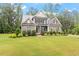 Beautiful two-story home boasting a well-manicured lawn and mature trees at 1508 Banks Brooke Dr, Raleigh, NC 27603