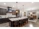 Spacious kitchen featuring stainless steel appliances, dark cabinetry, and a large central island at 1508 Banks Brooke Dr, Raleigh, NC 27603