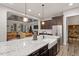 Stylish kitchen featuring a large island with seating, stainless steel appliances, and dark wood cabinets at 1508 Banks Brooke Dr, Raleigh, NC 27603